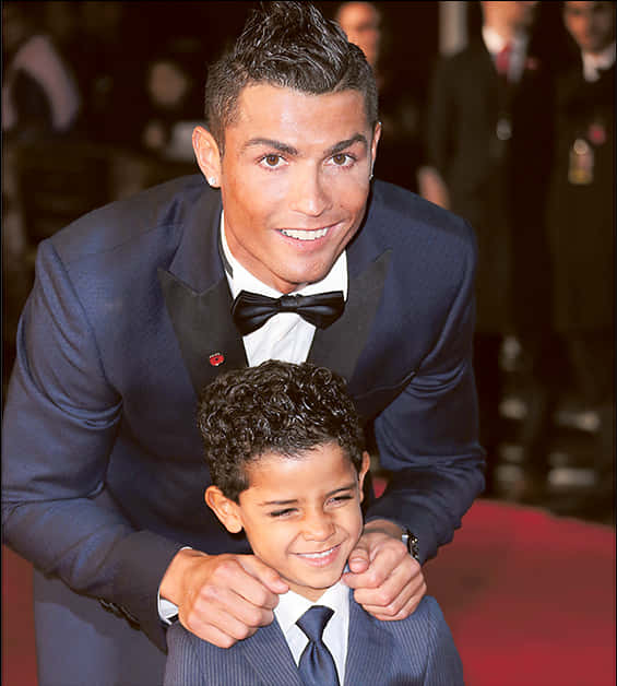 Cristiano Ronaldo Smiling With Child At Event