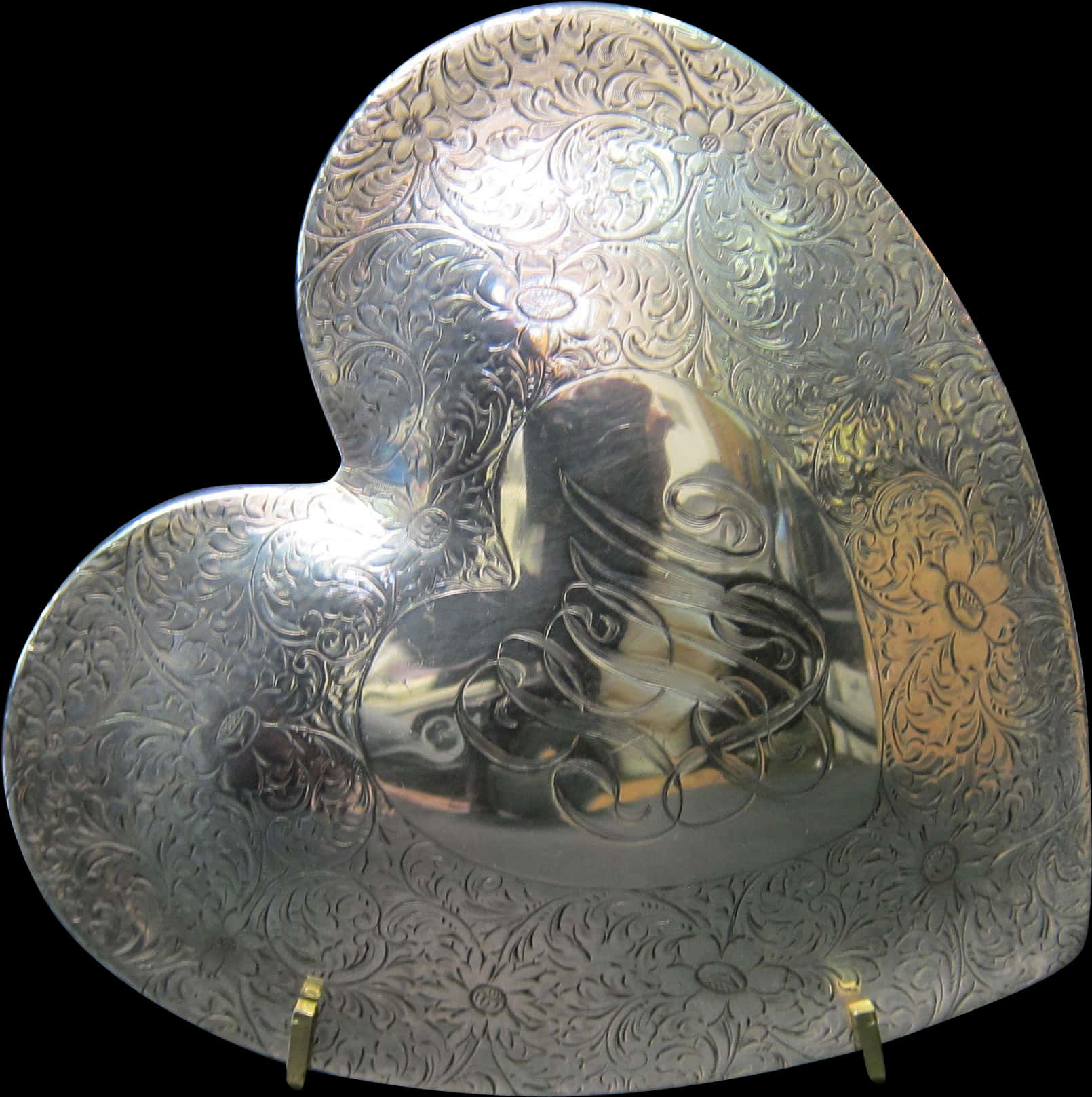 Engraved Silver Heart Shaped Object