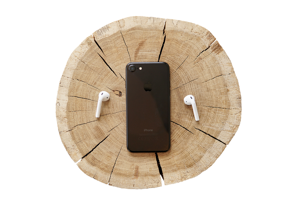 I Phoneand Air Podson Wooden Stump