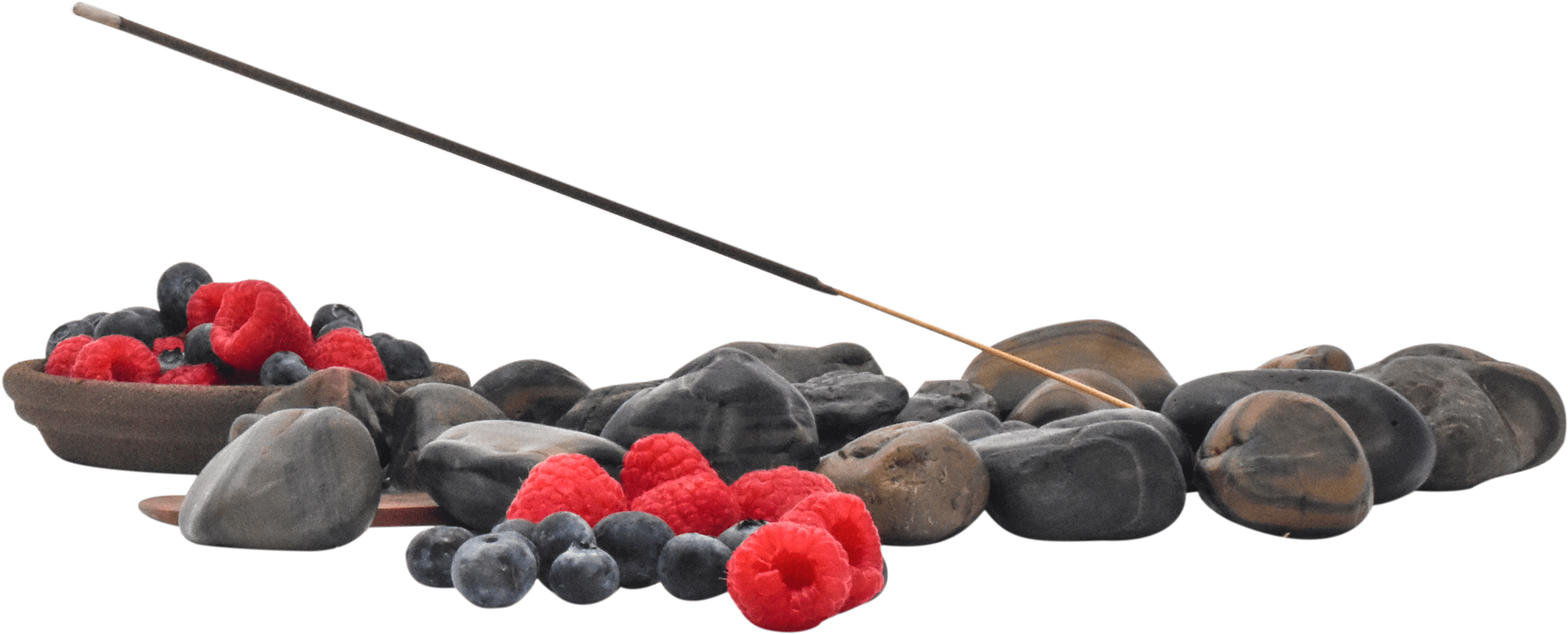 Incense Stick Above Stonesand Berries