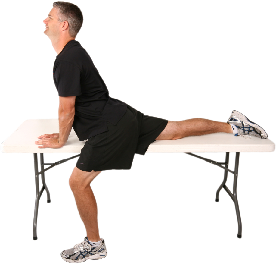 Man Performing Hip Flexor Stretchon Table