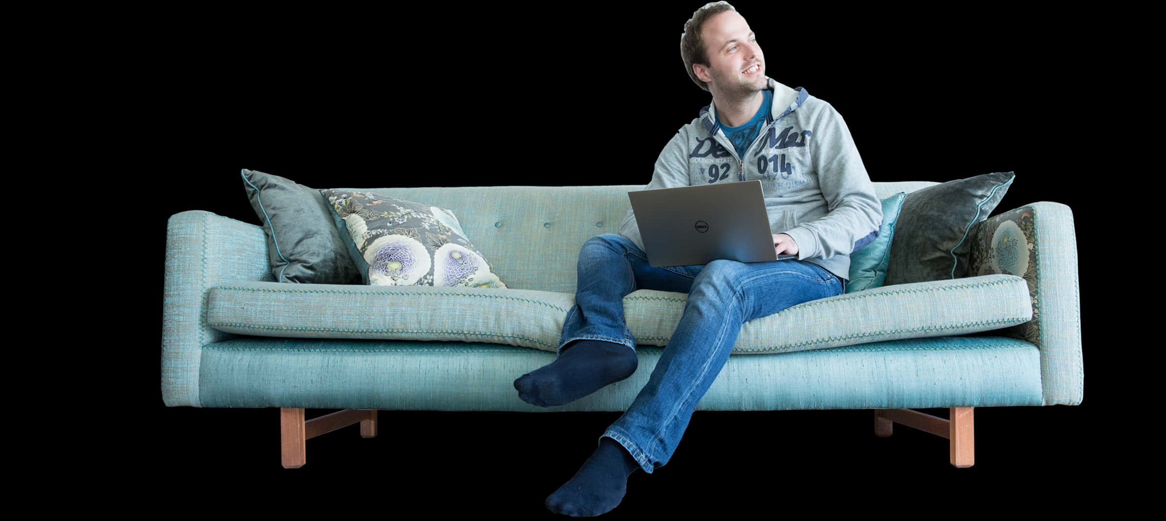 Man Relaxingon Sofawith Laptop