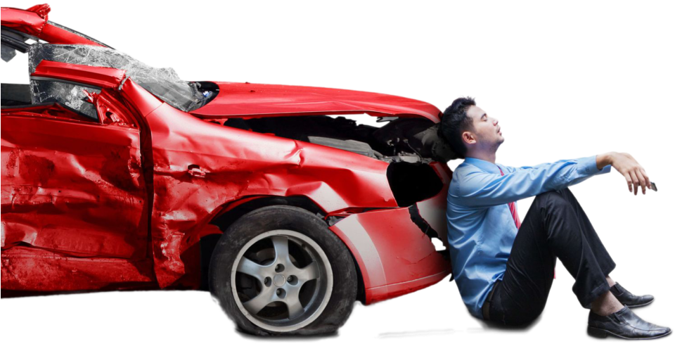 Man Sitting By Damaged Car After Accident