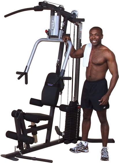 Man Smiling Beside Multi Gym Equipment