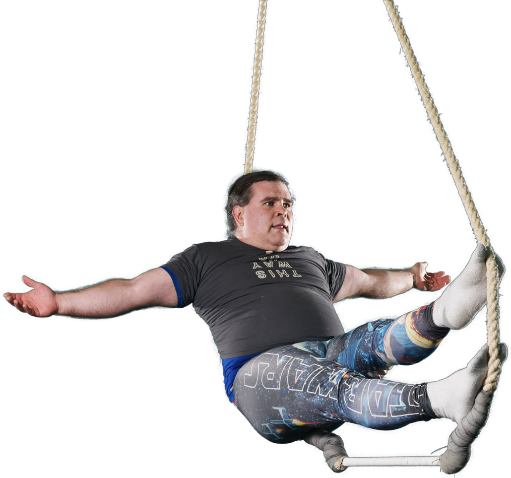 Man Swingingon Rope