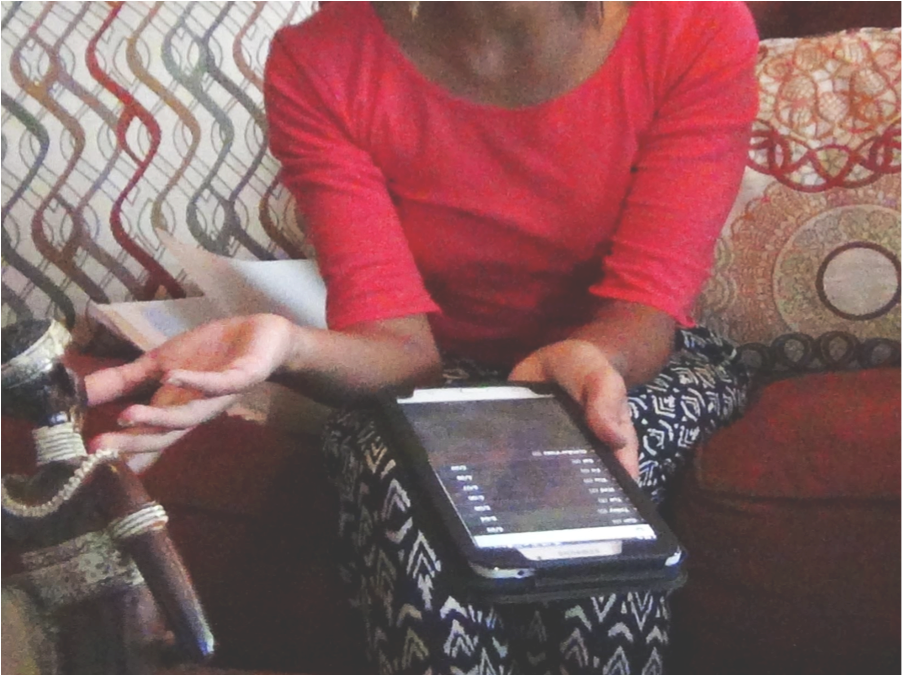 Person Using Tablet Indoors