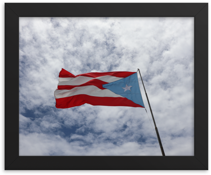 Puerto_ Rican_ Flag_ Against_ Cloudy_ Sky