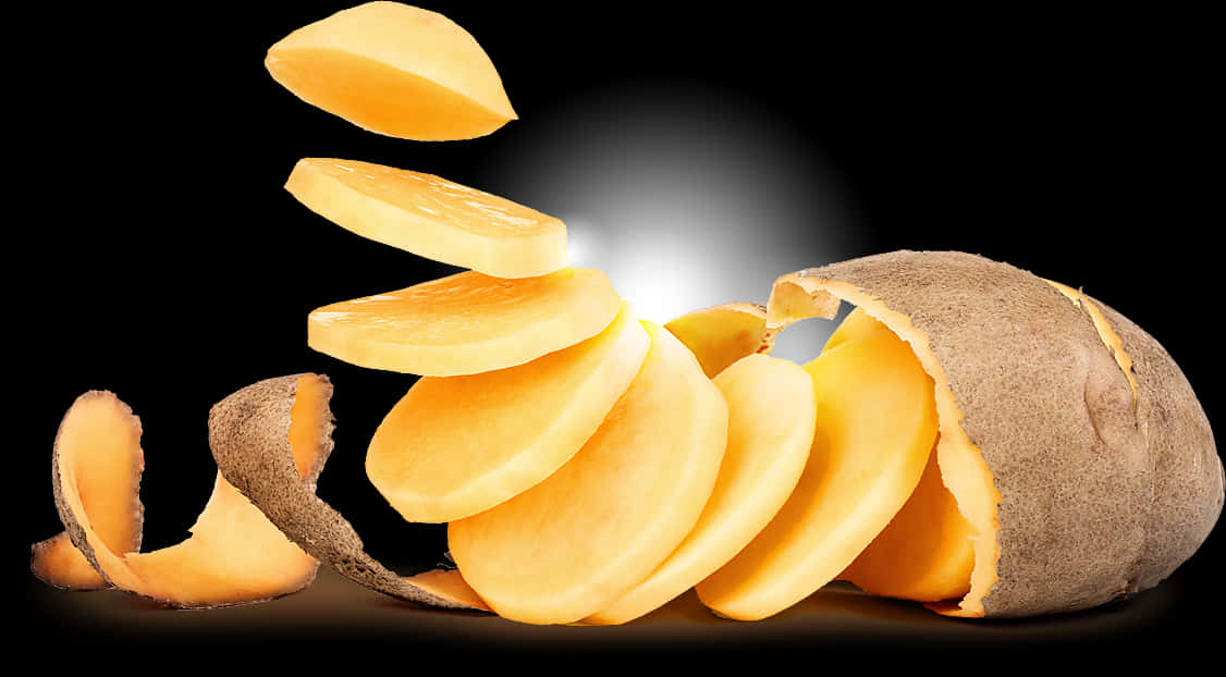 Sliced Potato Floating Against Black Background