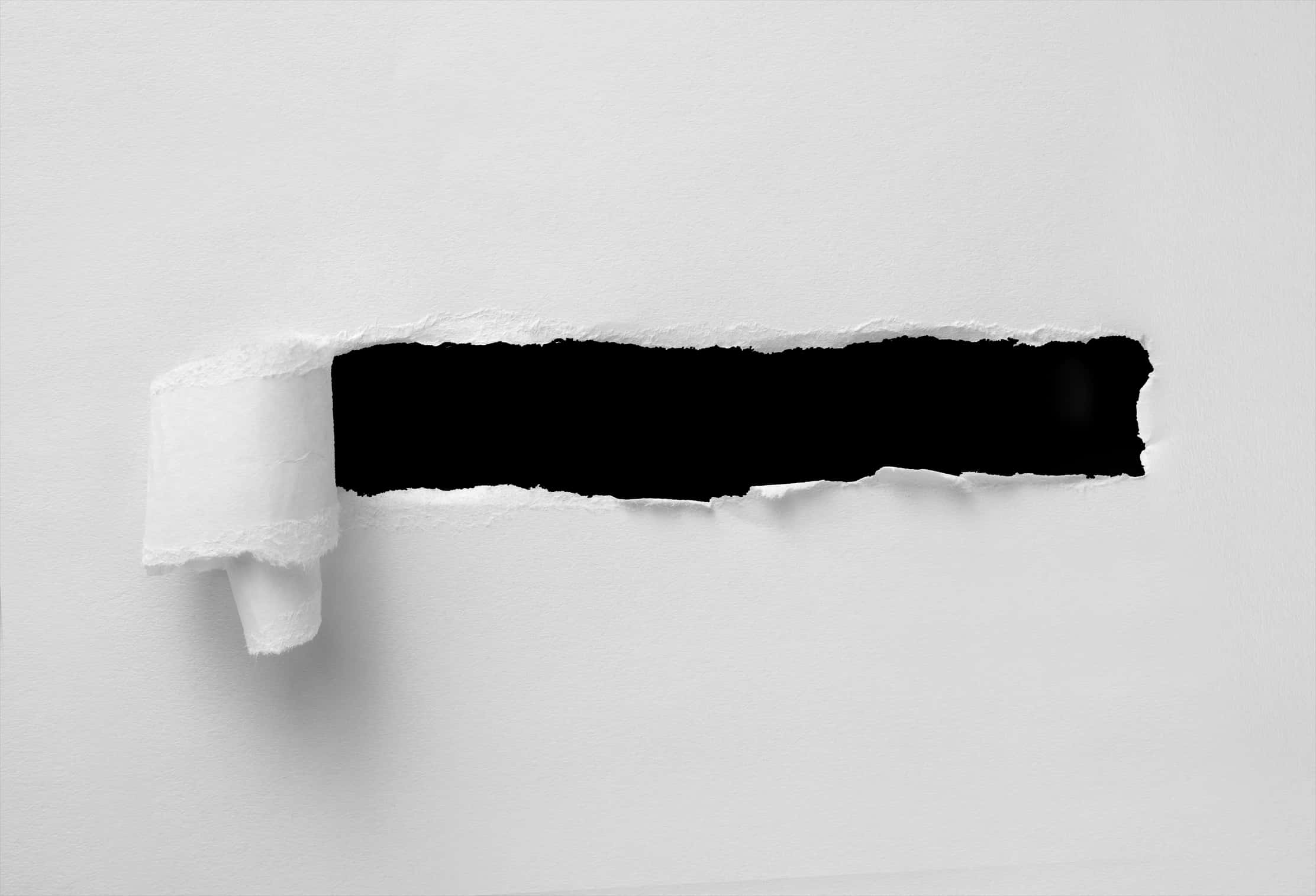 Torn Paper Revealing Black Layer