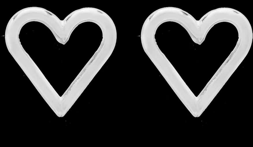 Twin Glass Hearts Black Background