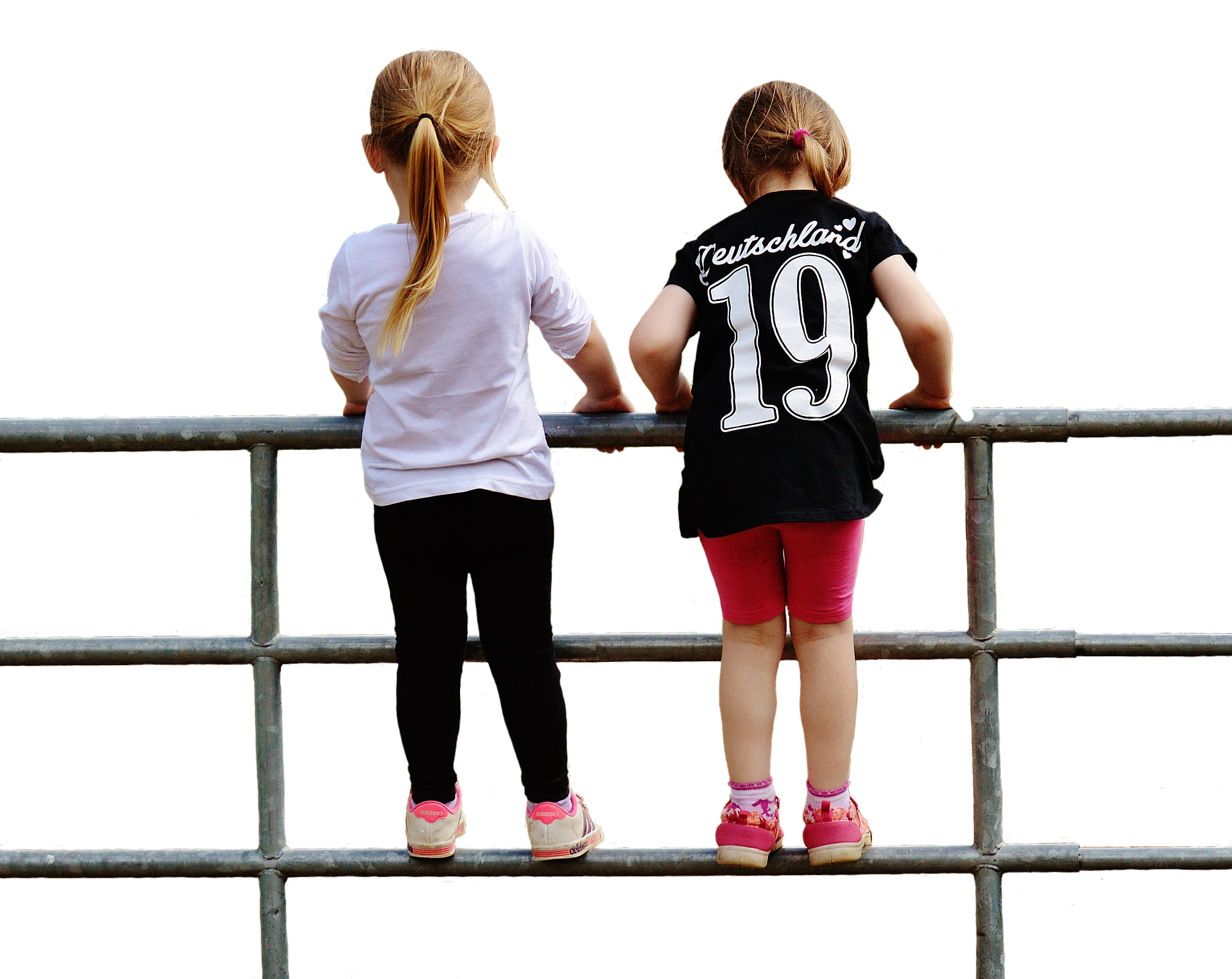 Two Girls Looking Over Fence