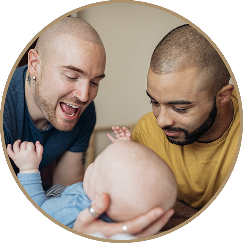 Two Men Admiring Baby