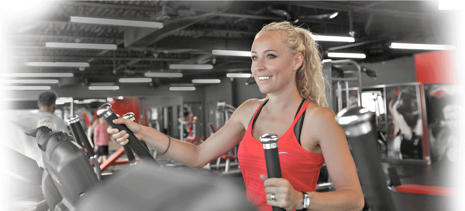 Woman Using Chest Press Machineat Gym