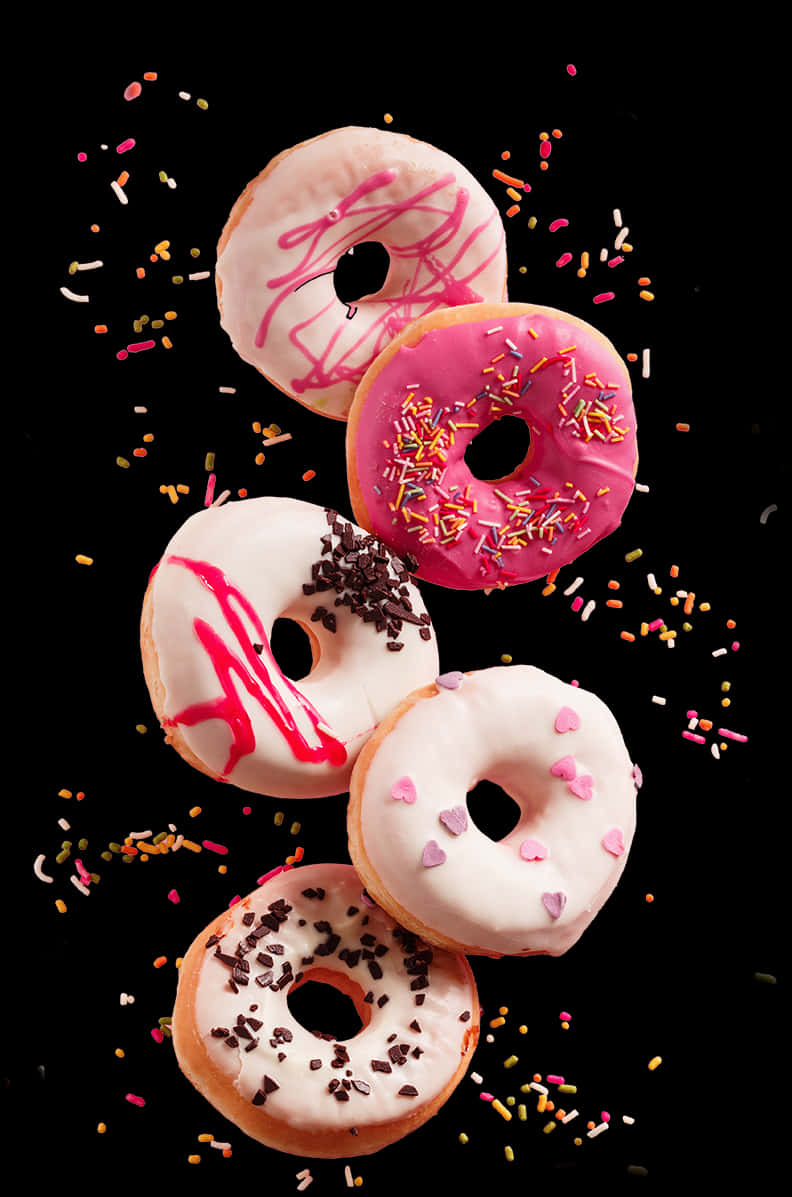 Assorted Donuts Fallingwith Sprinkles.jpg PNG Image