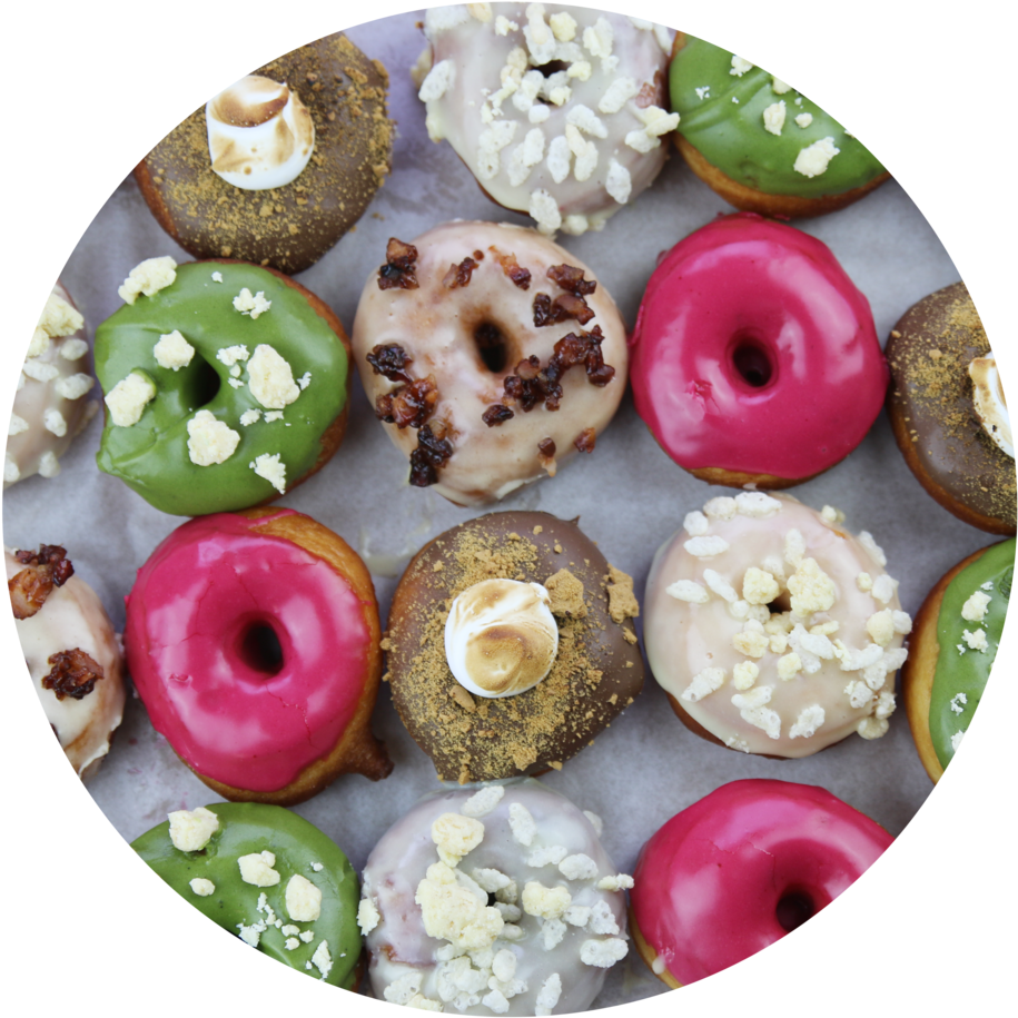 Assorted Gourmet Doughnuts Top View PNG Image