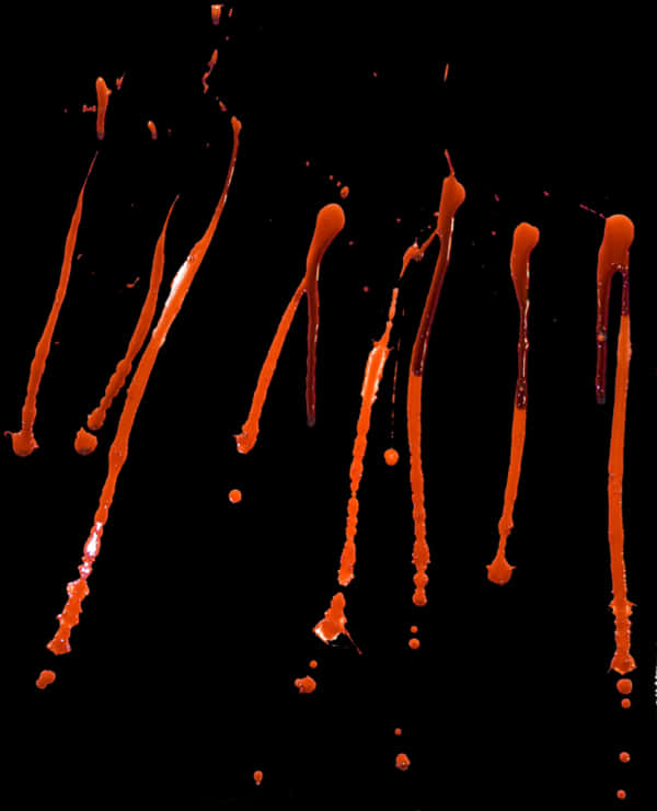 Blood Drops Falling Against Black Background PNG Image