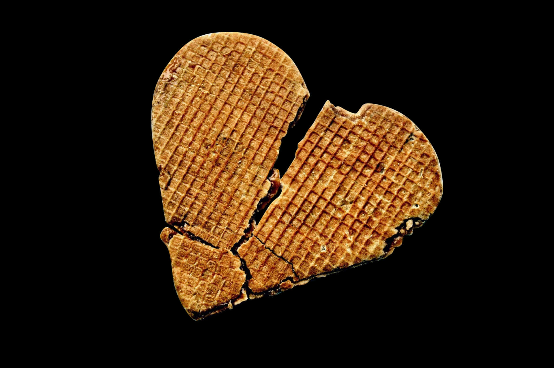 Broken Heart Cookieon Black Background PNG Image