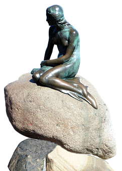 Bronze Mermaid Sculptureon Rocks PNG Image