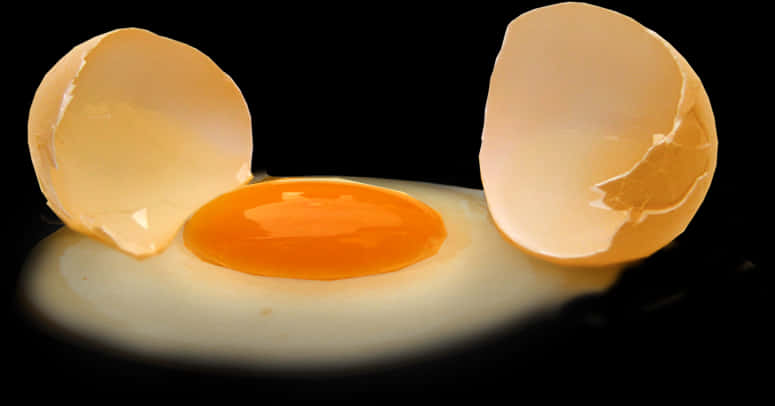 Cracked Eggon Black Background PNG Image