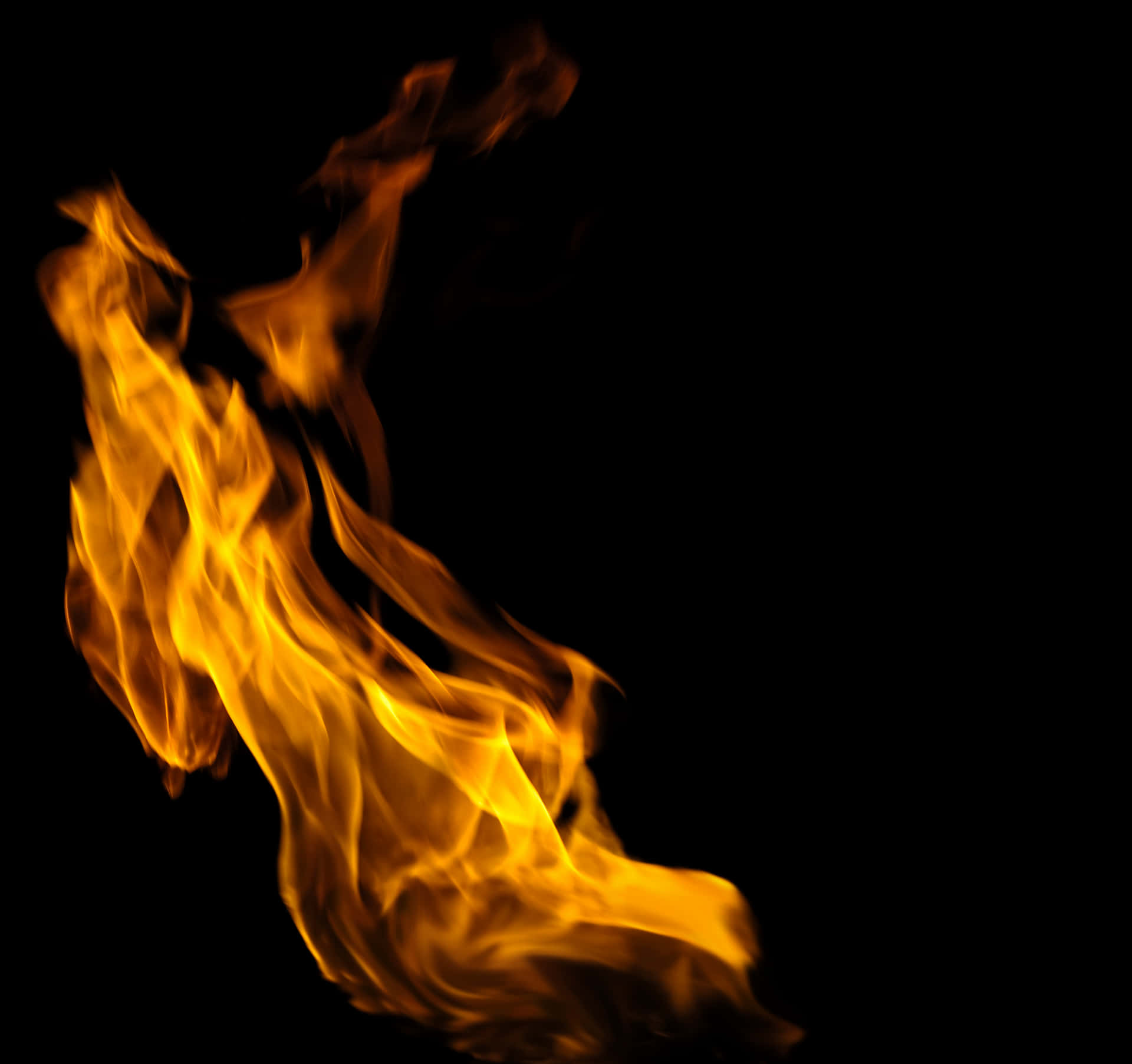 Dancing_ Flames_ Against_ Dark_ Background.jpg PNG Image