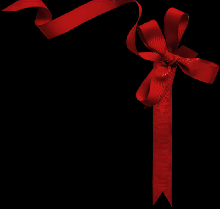 Elegant Red Ribbon Bowon Black Background PNG Image