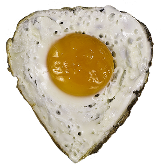 Heart Shaped Fried Eggon Black Background PNG Image