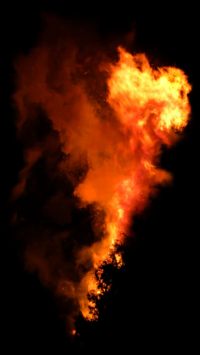 Intense_ Fire_and_ Smoke_ Against_ Dark_ Background.jpg PNG Image