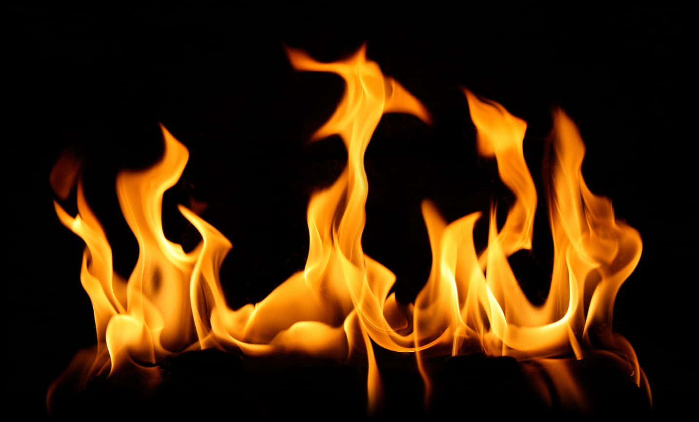 Intense Flames Dancingon Black Background PNG Image