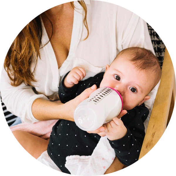 Mother Feeding Baby With Bottle PNG Image