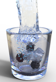 Pouring Water Into Glass With Fruit Ice Cubes PNG Image