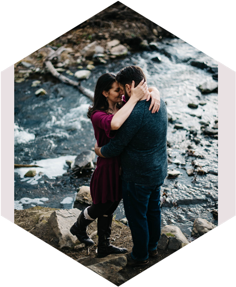 Romantic Couple Embrace Riverbank PNG Image