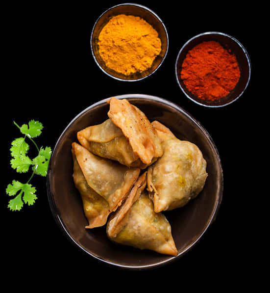 Samosaswith Spiceson Black Background PNG Image