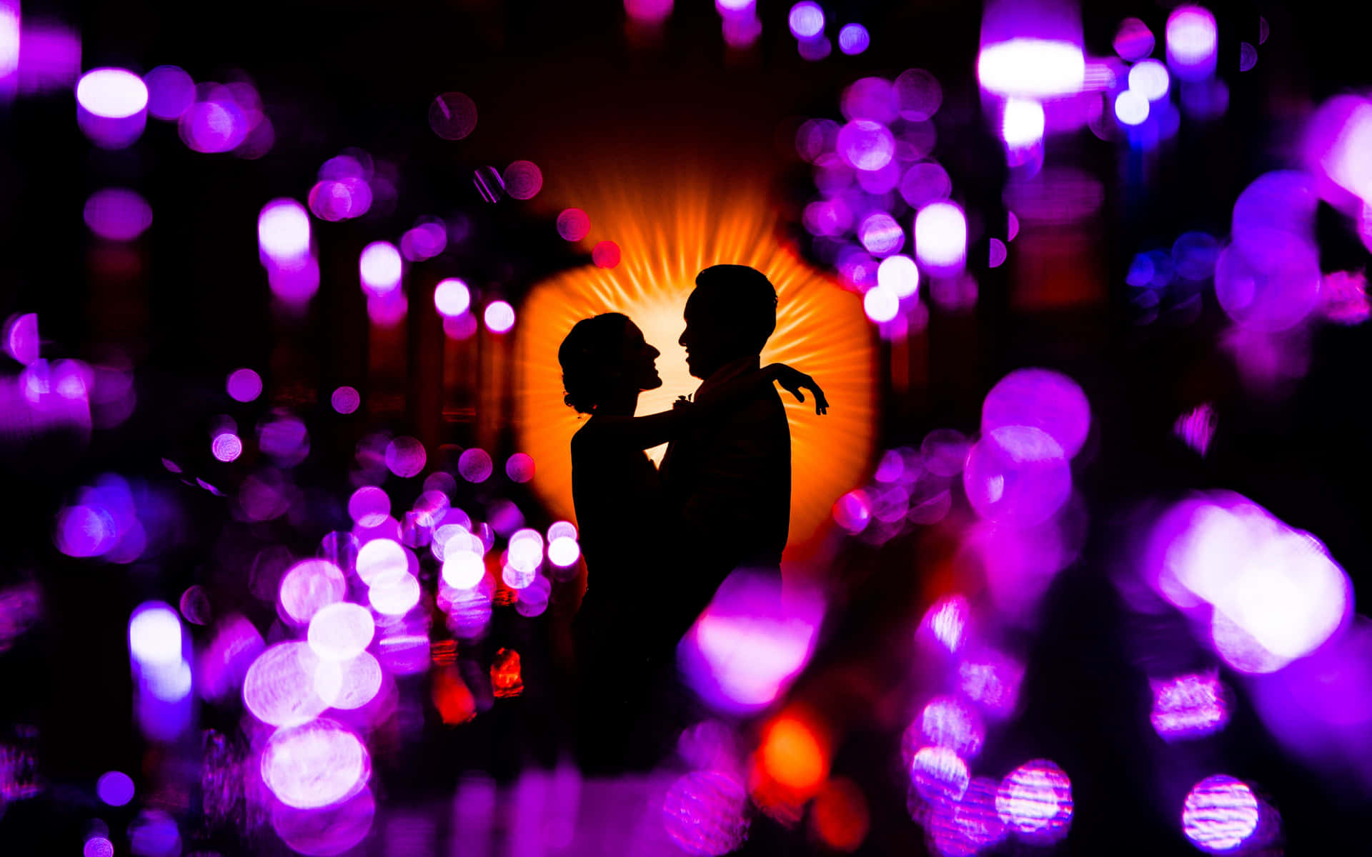 Silhouette Love Amidst Shimmering Lights PNG Image