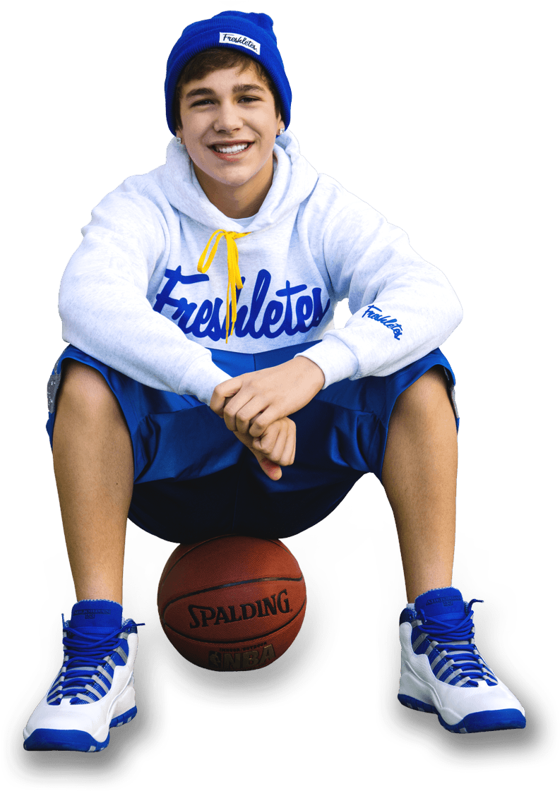 Smiling Teen Basketball Player Sitting PNG Image