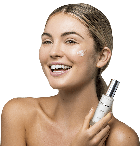 Smiling Woman Skincare Product Demonstration PNG Image