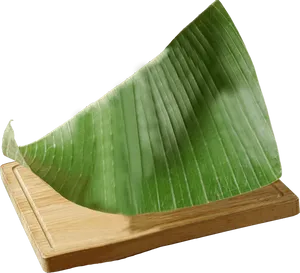 Banana Leafon Wooden Base PNG Image