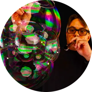 Bubble Blowing Manwith Colorful Soap Bubbles PNG Image