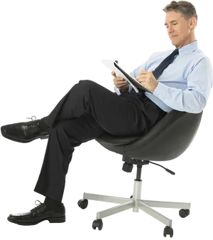 Businessman Relaxingin Office Chairwith Tablet PNG Image