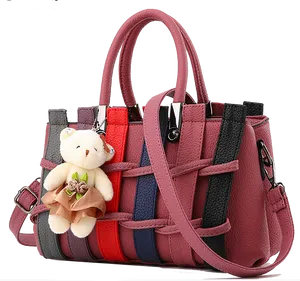 Colorful Striped Handbagwith Teddy Bear Charm PNG Image