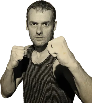 Determined Man Boxing Pose PNG Image