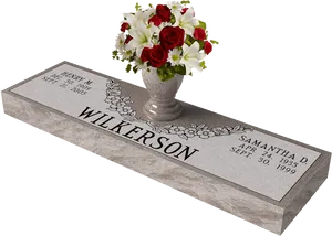 Elegant Grave Markerwith Floral Arrangement PNG Image