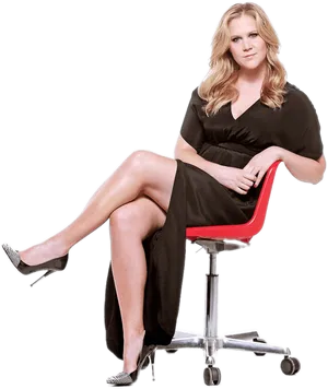 Elegant Woman Seatedin Red Office Chair PNG Image