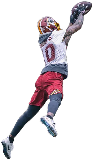 Football Player Catching Ballin Midair PNG Image