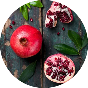 Fresh Pomegranateand Seedson Wooden Background PNG Image