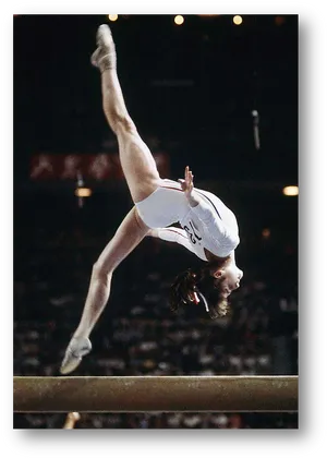 Gymnast_ Performing_ Balance_ Beam_ Routine PNG Image