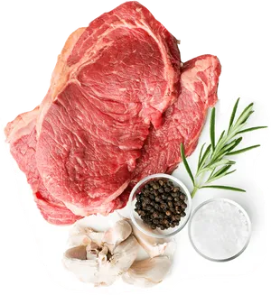 Raw Steakwith Herbsand Spices PNG Image