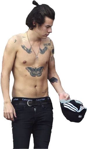 Shirtless Manwith Tattoosand Hat PNG Image