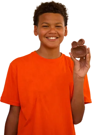 Smiling Boy Holding Chocolate Bunny PNG Image