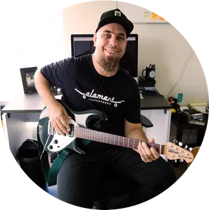 Smiling Guitarist Office Setting PNG Image