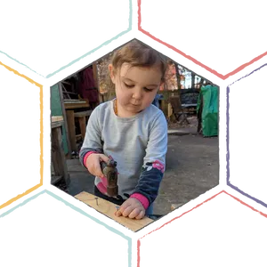 Toddler Using Hammer Outdoors PNG Image